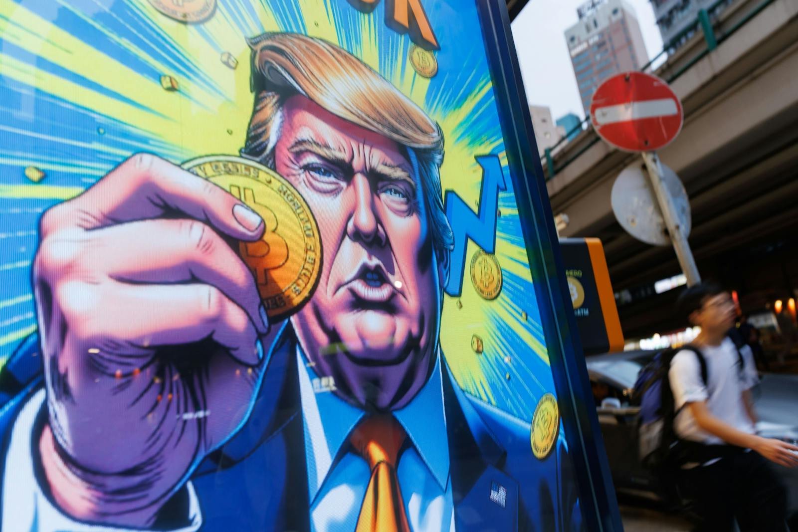 Bitcoin ETFs suffer near $1 billion in outflows in 2 days, as Trump Media withdraws bitcoin ETF application 5 2208409748 people walk past an advertisement feature donald trump with bitcoin in hong kong on sunda